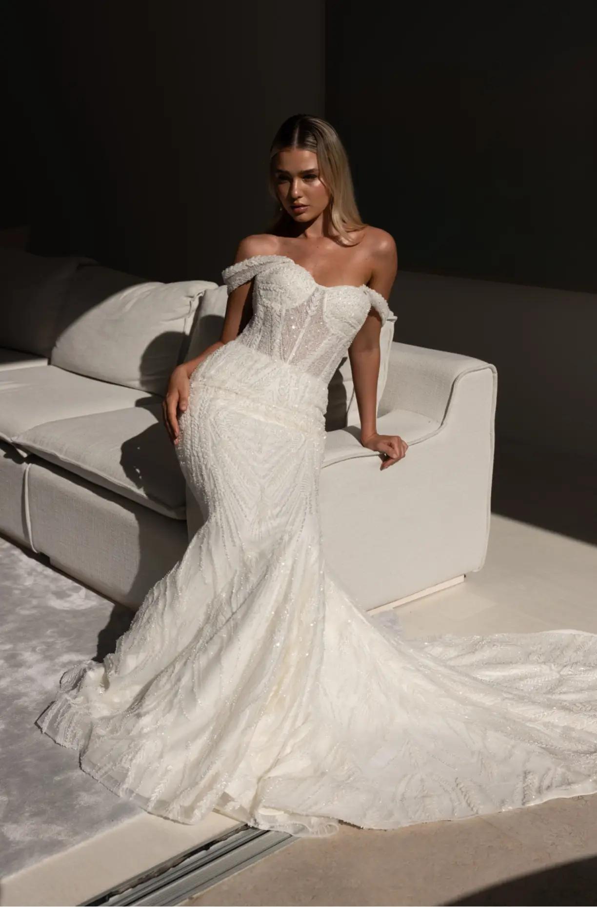 Photo of the model in a white gown